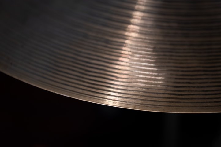 Close-up of cymbal with stand.