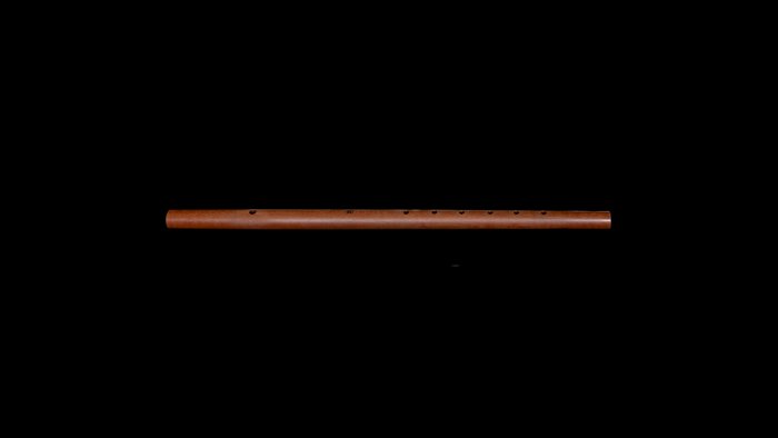 Renaissance traverse flute in light wood against black background.